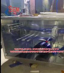 Automatic plastic ampoule liquid packing machine with a labeling machine.