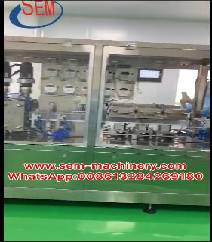 Automatic plastic ampoule liquid packing machine with a labeling machine.